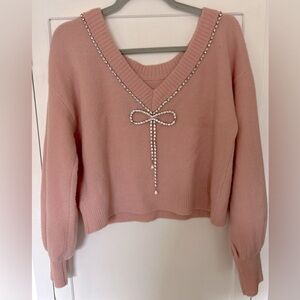 Like new express pink sweater with bow size small